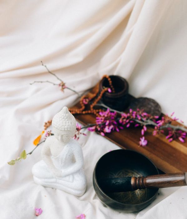 Woman in a calm yoga pose symbolizing balance and tranquility.